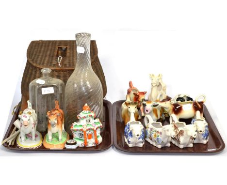 A small group of late 19th/20th century cow creamers, a Victorian pastel burner, a photograph album, cigarette card album, de