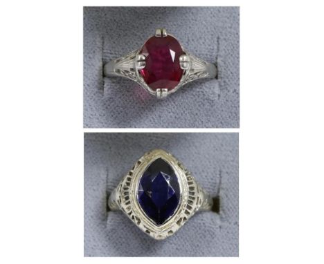A synthetic sapphire ring, a marquise cut synthetic sapphire in a rubbed over setting, to a pierced tapering shank, finger si