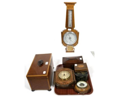A 19th century mahogany tea caddy, three barometers etc 