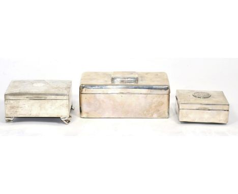 A silver cigarette box with integral vesta case to cover, London 1901; a silver jewellery box, Elkington 1911;  and a further