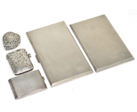 A silver cigarette case, Birmingham 1928; another, Birmingham, 1947; an Edwardian silver vesta, Birmingham, 1909; with two ot