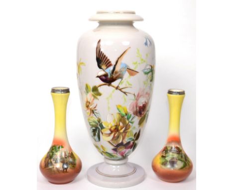 A Continental opaque glass vase painted with a garden bird perched on a branch amongst flowers; together with a pair of silve