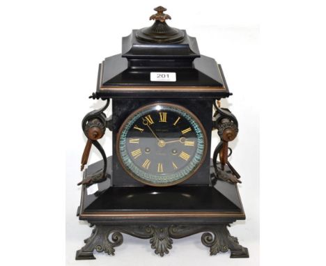 A late 19th century metal mounted black slate mantel clock, the dial signed 'Vaughan, Newport' 