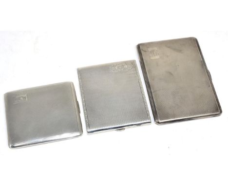 Three various engine turned silver cigarette cases, the largest 13cm long, 14.6ozt 