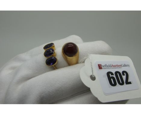 An Amethyst Three Stone Ring, oval collet rubover set with uniform stones, stamped ""9ct" (finger size P) (2.6grams); togethe