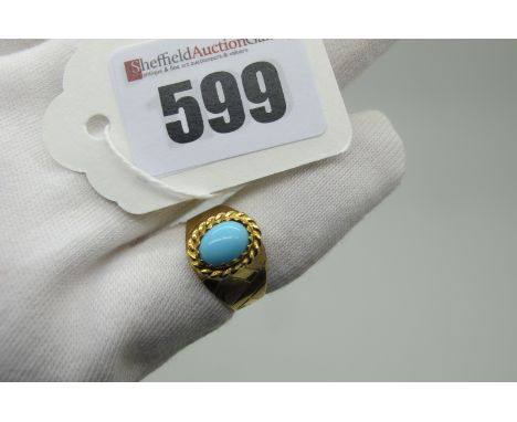 A Middle Eastern Single Stone Dress Ring, oval cabochon set, between high tapering textured shoulders, indistinctly stamped "