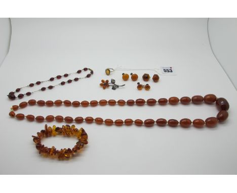 A Cherry Amber Coloured Faceted Bead and Wire Necklace, 36cm long; together with an amber coloured graduated bead necklace, a