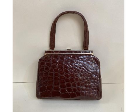 A tan crocodile Ladies Vintage handbag 