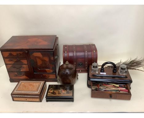 A modern desk stand/inkwell with drawer containing quills, a modern cigar cutter, and various decorative modern boxes and cas