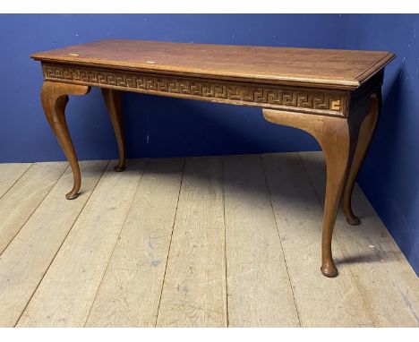 A light honey coloured oak sidetable with cabriole legs below a shaped frieze 161cmL x 54cm X 80cmH 
