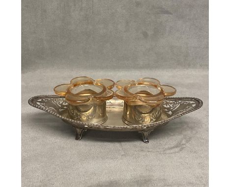 A Sterling silver double desk inkwell, with two glass inserts on a pierced stand, raised on four feet by Hasseler Brothers, L