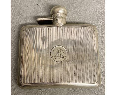 A Sterling silver hip flask with engine turned decoration by Sampson Morden &amp; Co London 1919, 120g 