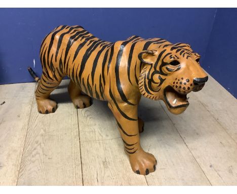Painted model of a tiger, 54 cm High x overall length approx 107cm; Condition - some minor scuffs, damaged end of tail; light