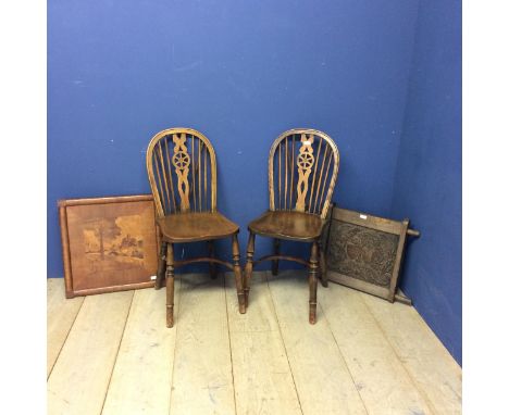 Two elm stick back chairs, an carved oak panel, engraved crest inscribed with "Unity &amp; Loyalty", and a hanging wooden wal