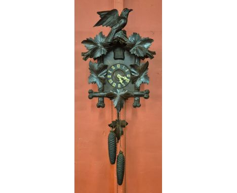 An early 20th Century Black Forest carved wood cuckoo clock 