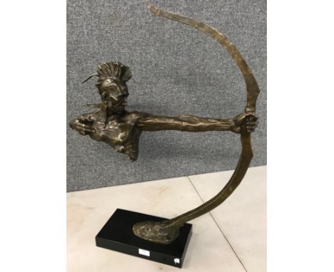 An abstract bronze of a Native American warrior 