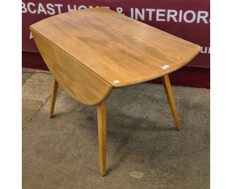 A Ercol Blonde elm and beech Windsor drop leaf table 