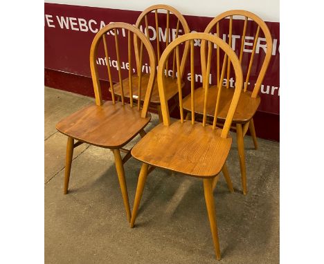 A set of four Ercol Blonde elm and beech Windsor chairs 