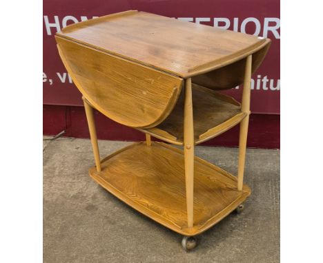 An Ercol Blonde elm Windsor trolley 