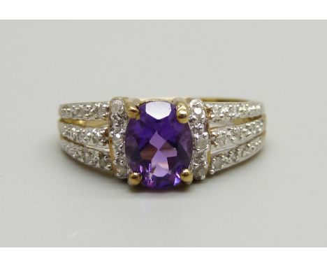 A 9ct gold, amethyst and twenty stone diamond ring, 2.7g, N 