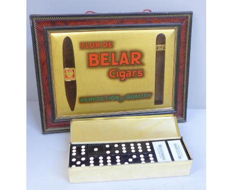 A set of Woodbines Cigarettes advertising dominoes in tin and a tin-plate Flor De Belar Cigars advertising sign, with back st