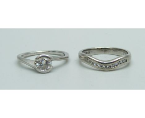 A platinum and diamond engagement ring, 0.5ct diamond weight, colour F, clarity SI2, 2.8g, J, and a platinum ring set with el