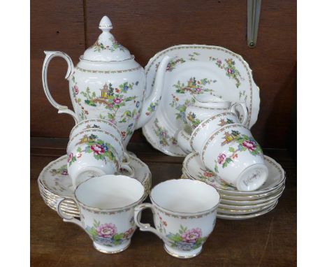 A Crown Staffordshire six setting china Pagoda pattern tea service, six cups, saucers, small plates, teapot, sugar, cream and