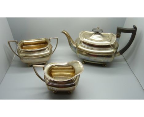 A three piece Walker &amp; Hall silver tea service, 1236g, (40oz.) 