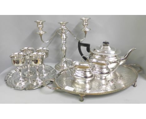 A Viners three piece plated tea service and a similar chased tray, a candelabra, another tray and four goblets 