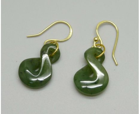 A pair of silver gilt and jade earrings 
