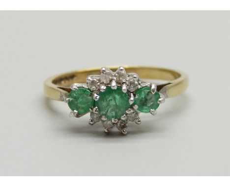 A 9ct gold, emerald and diamond cluster ring, 2.1g, N 