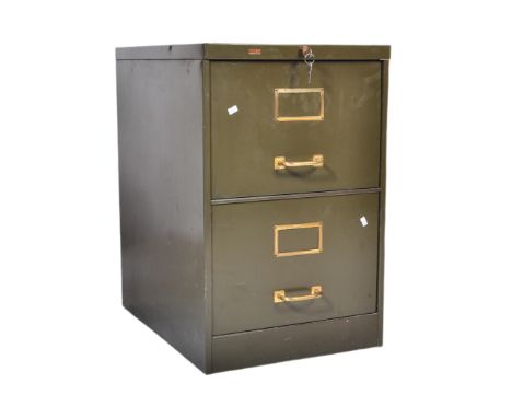 A mid 20th Century retro vintage industrial metal filing cabinet. Rectangular form with a bank of two deep drawers with brass