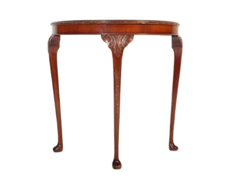 Queen Anne revival walnut console table. Raised on cabriole legs with pad feet having carved acanthus leaf shoulders to the l