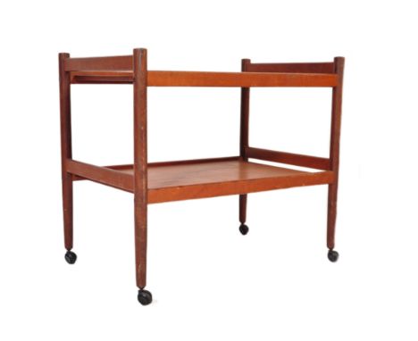A vintage retro mid 20th century teak wood hostess drinks serving trolley having under tier over castors.&nbsp;Measures appro