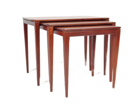 A retro vintage mid 20th century teak wood nest of graduating tables designed by Richard Hornby for Fyne Lady having a shaped