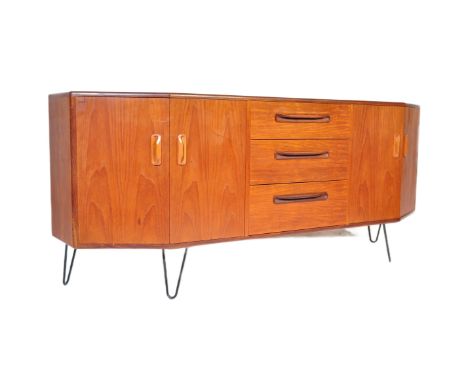 British Modern Design. A retro vintage mid 20th century G-Plan teak wood sideboard. The sideboard having a central bank of th