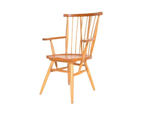 A retro vintage mid 20th Century beech and elm G Plan Windsor chair. Having a spindle back with straight arms, indented seat 