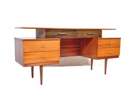 A retro vintage mid 20th century Austin Suite floating desk dressing table a straight chamfered edge top resting on a twin ha