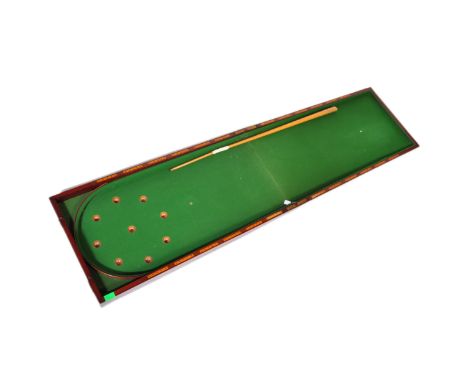 A 19th Century table top billiards game in a folding mahogany case. With green felt to base and interior with number ball slo