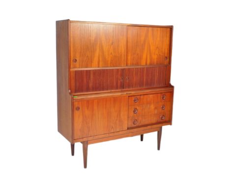 Johannes Andersen - A retro vintage mid 20th Century circa 1960s teak wood Danish high sideboard. The highboard having twin s