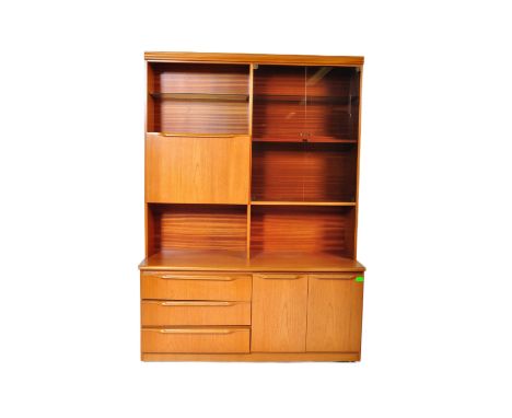 A retro vintage mid 20th century G-Plan teak upright display unit having shelves to top over a fall front cupboard aside glaz