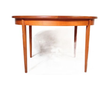 G Plan - British Modern Design - A retro vintage mid 20th Century circa 1960s extendable dining table. The table of circular 