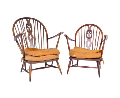 A pair of retro vintage mid 20th Century beech &amp; elm fleur de lis low arm chairs. Both having round spindle backs with st
