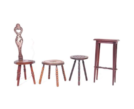 An assortment of early 20th century and later oak furniture pieces to include a carved Welsh spinning chair with Gwibers to b