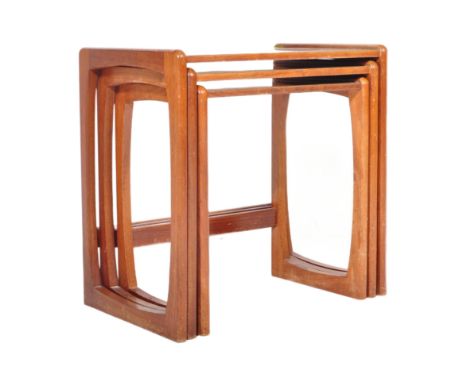 A vintage retro mid 20th century circa 1960s nest of tables having teak wood supports resembling G Plan Quadrille range and F