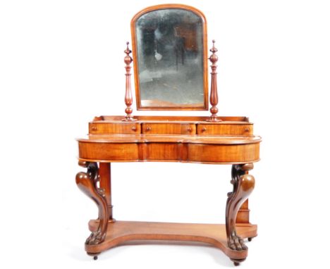 A Victorian 19th century large mahogany Duchess dressing table. Raised on hairy paw feet legs with lower tier having a serpen