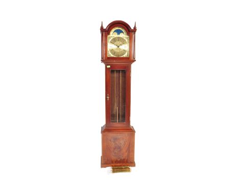 A 20th century longcase grandfather clock. The clock having a gilded moon phase face ornate brass spandrels to each corner an