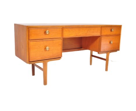 A retro vintage mid 20th Century teak wood dressing table. Of rectangular form with single secret drawer to middle flanked by