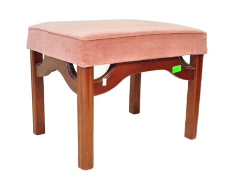 A mid 20th Century retro vintage mahogany G Plan footstool. Of rectangular form with pink upholstered padded seat raised on m