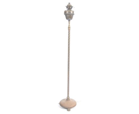 Victorian 19th century brass floor standing oil lamp converted to electricity. Oil lamp reservoir and cage support raised on 
